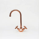Copper gooseneck bathroom faucet – installed on bathroom vanity