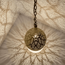 Close-up of pierced brass teardrop pendant light intricate detail – Brass For Homes