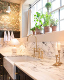 Polished brass bridge kitchen faucet with side sprayer – front view