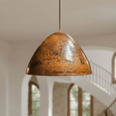 Close-up of hand-hammered copper dome pendant surface texture — Brass For Homes