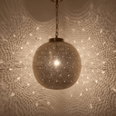 Handmade brass globe pendant light glowing with warm amber light – Brass For Homes