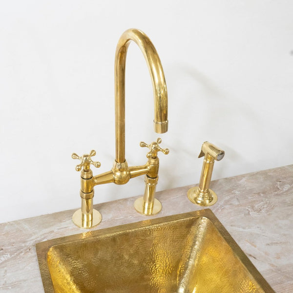Brass bridge kitchen faucet with pull-down sprayer – front view