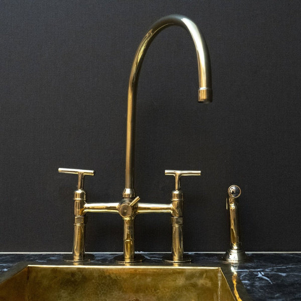 Unlacquered brass 3-hole bridge kitchen faucet with lever handles – front view