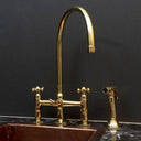 Unlacquered brass bridge faucet with sprayer – side view