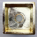 Hammered unlacquered brass kitchen sink – top-down view of bowl